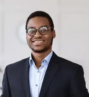 cheerful young black man manager 600nw 2510693647 e1752151673624